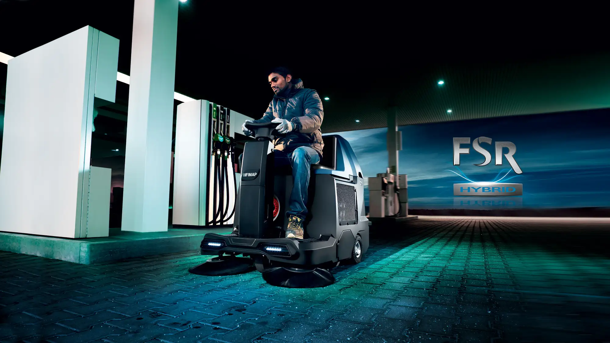 Fimap FSR Hybrid ride-on sweeper on a service station forecourt at night