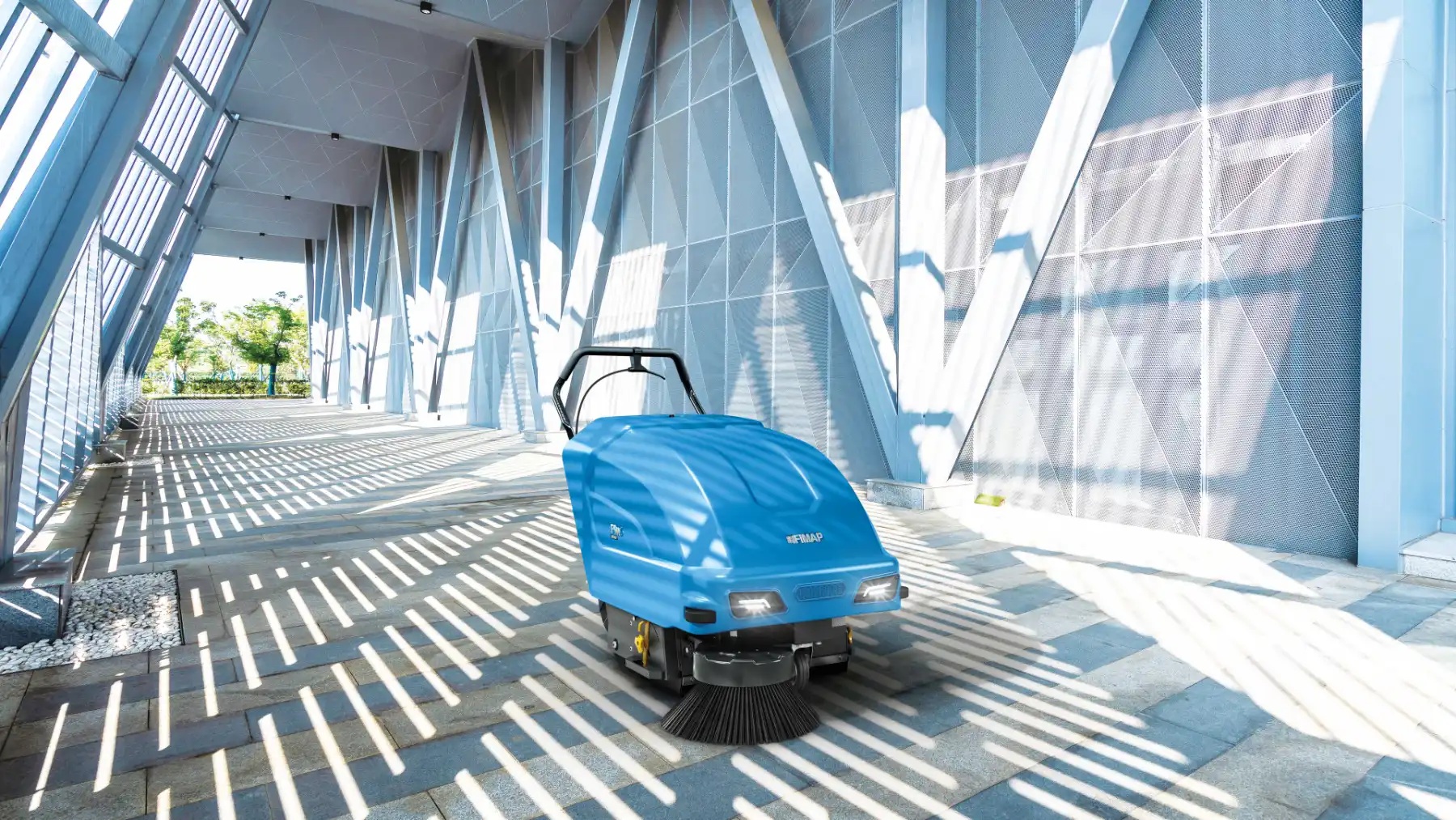 Fimap FSW walk-behind sweeper on a paved walkway