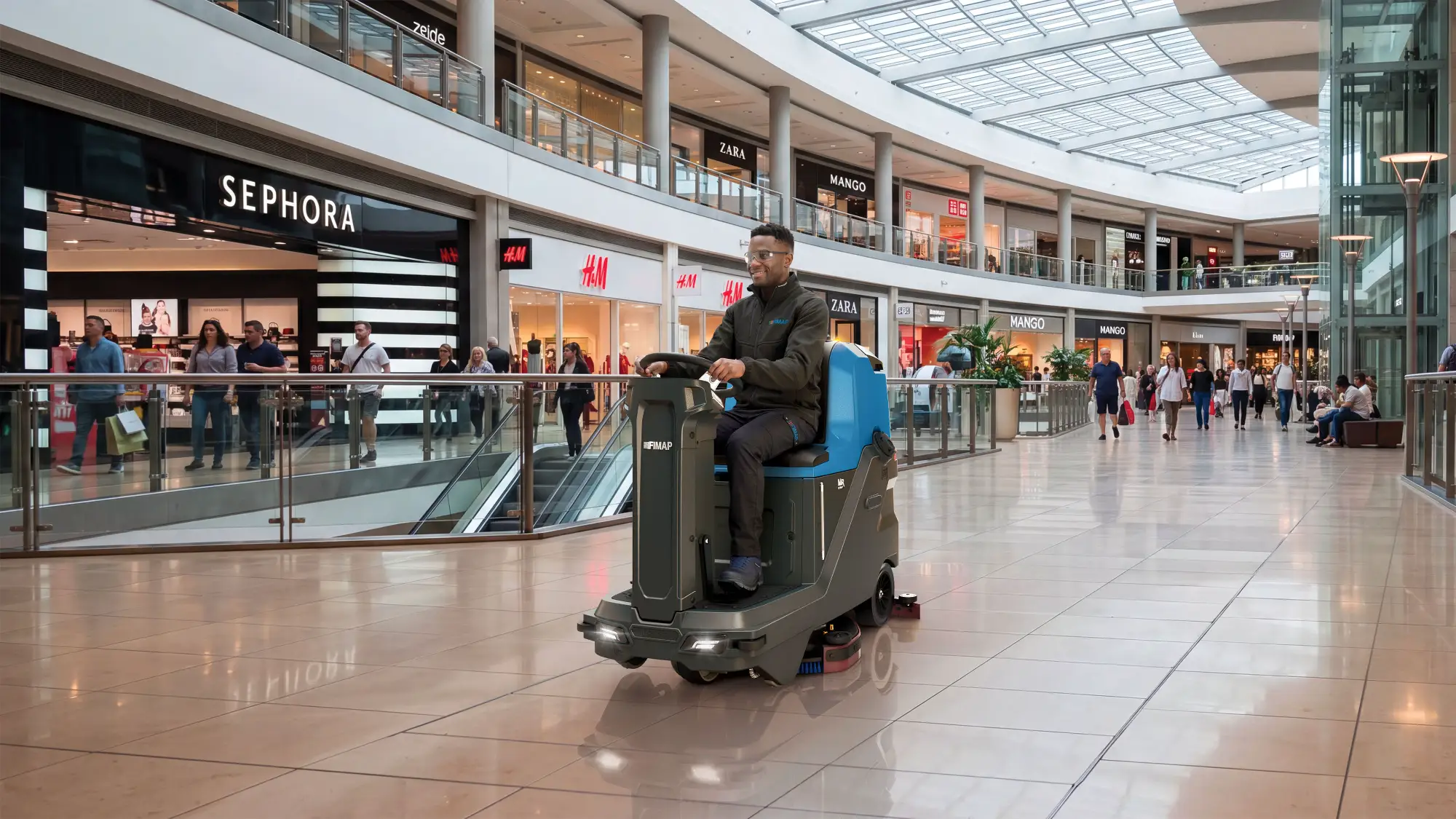 Fimap MR 75 ride-on scrubber cleaning a shopping centre floor