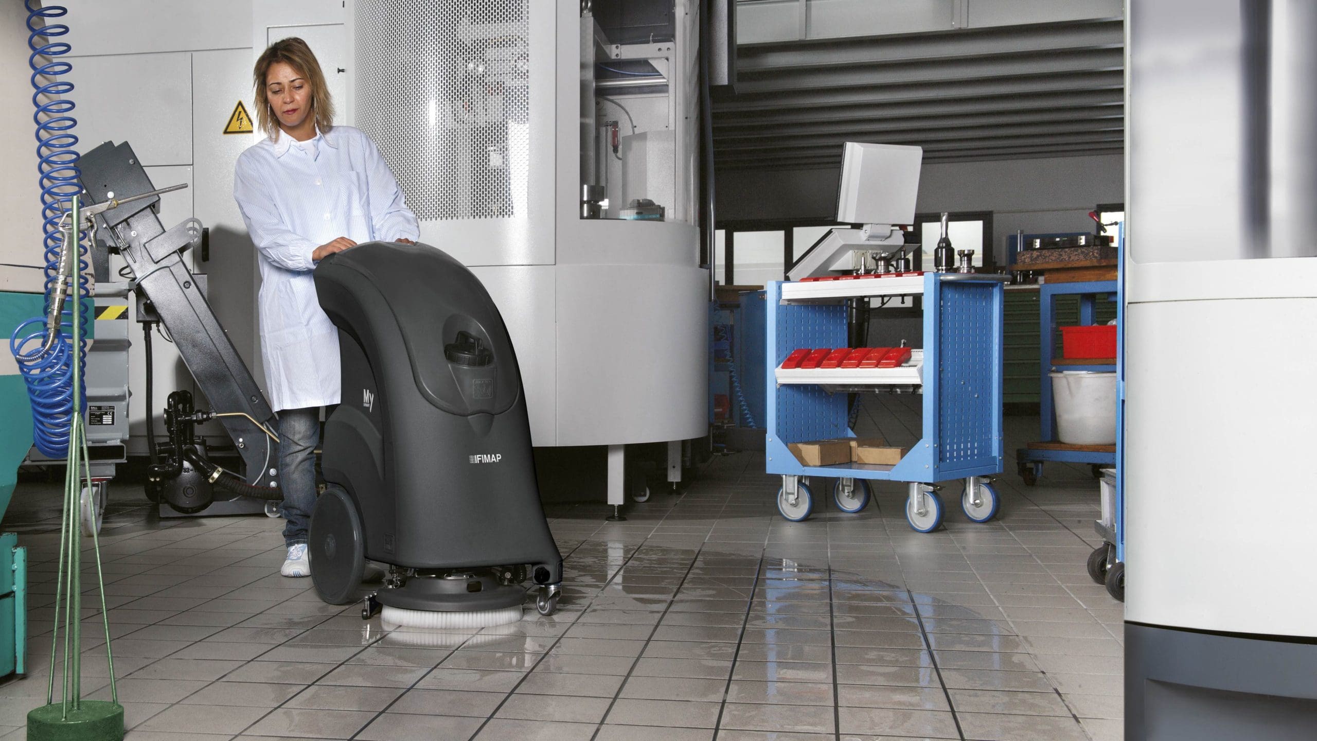 Commercial Cleaning Equipment - Scrubbing Kitchen Floors